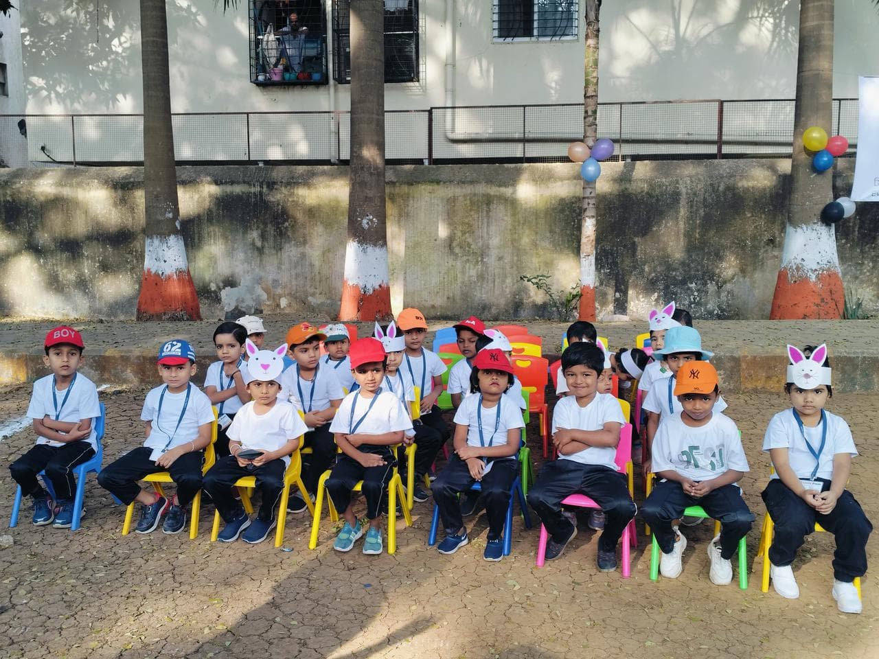 Children seated for Little Feet's Pre School sports day