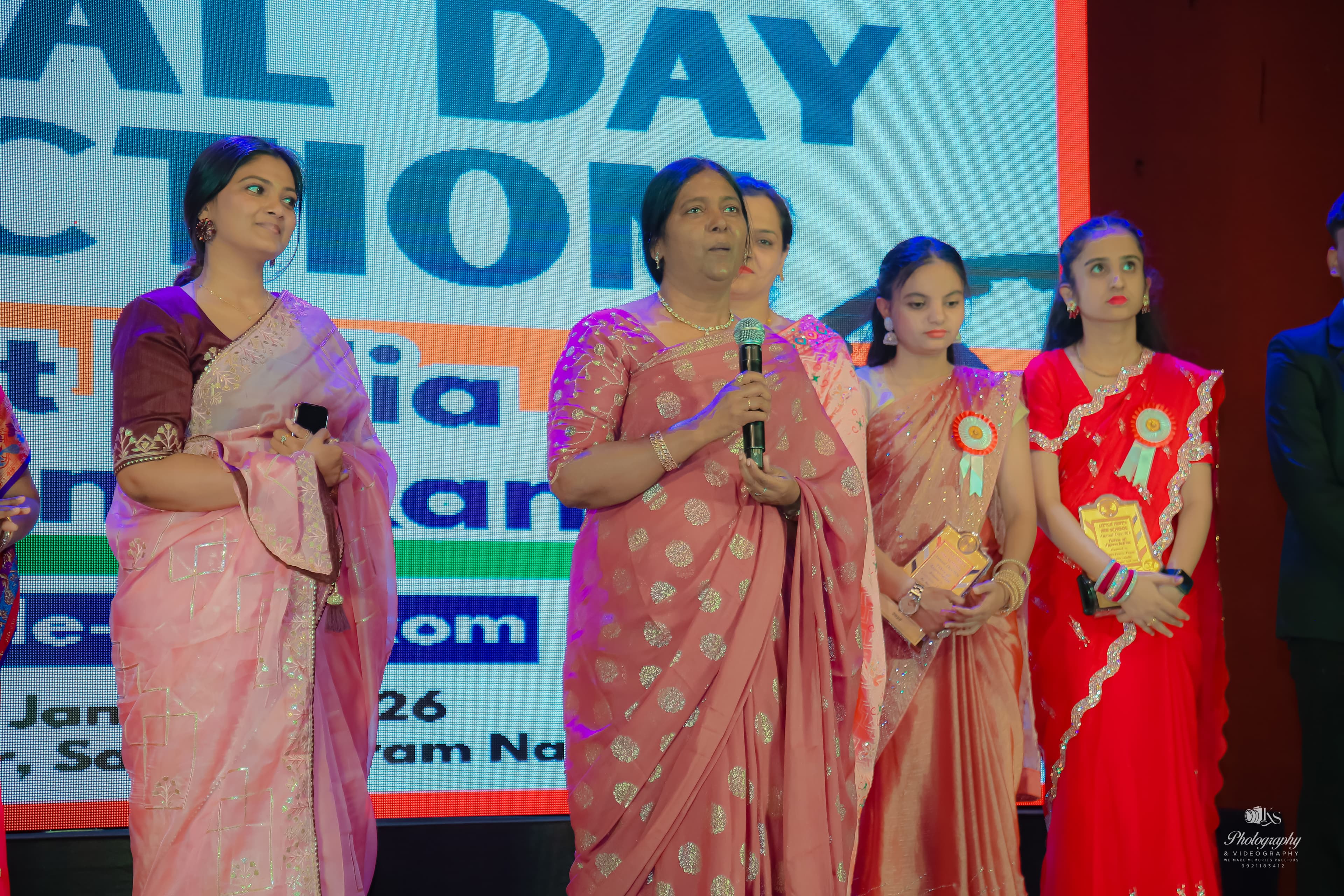 Annual day guests and teachers on stage at Little Feet's Pre School