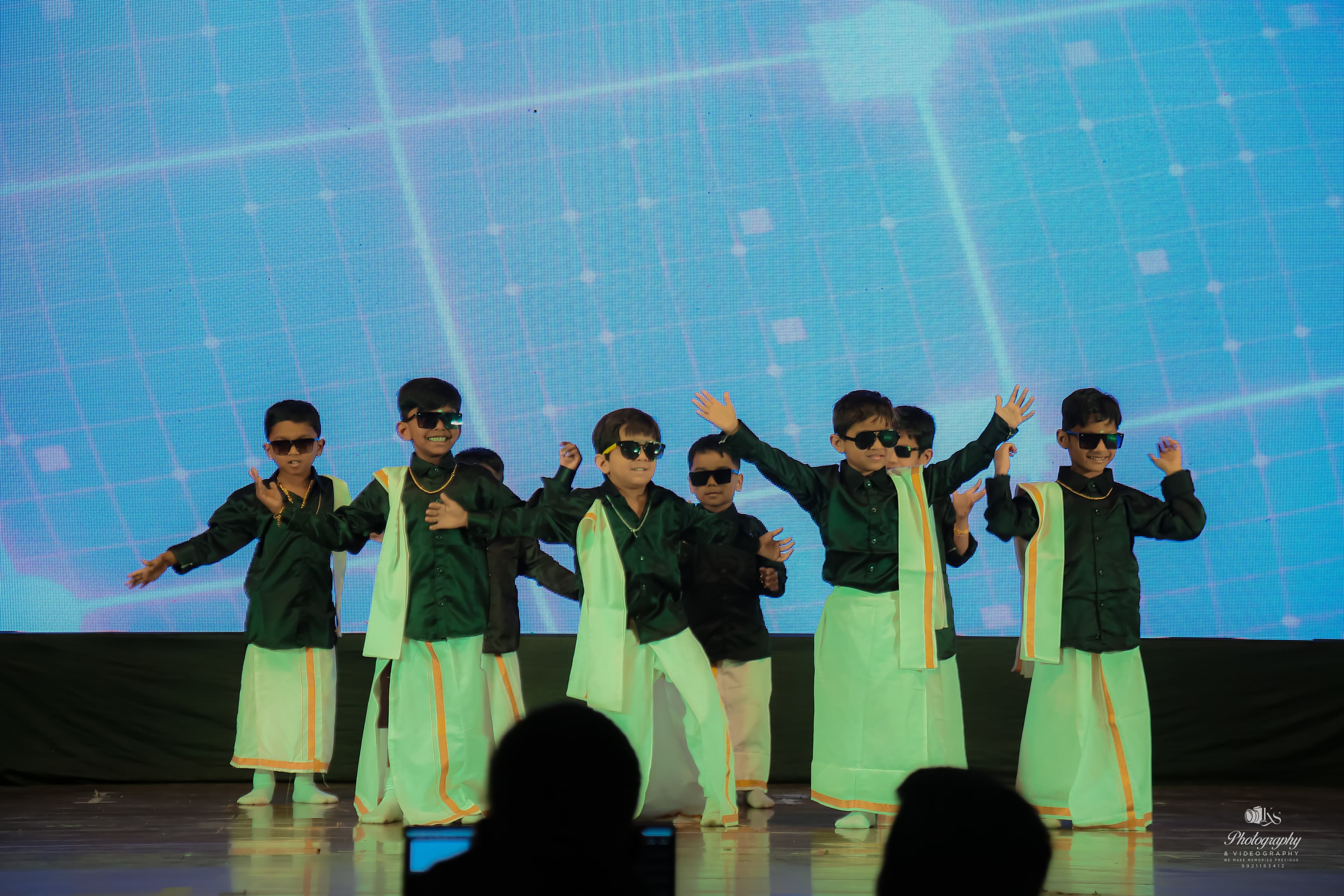 Children performing on stage at Little Feet's Pre School