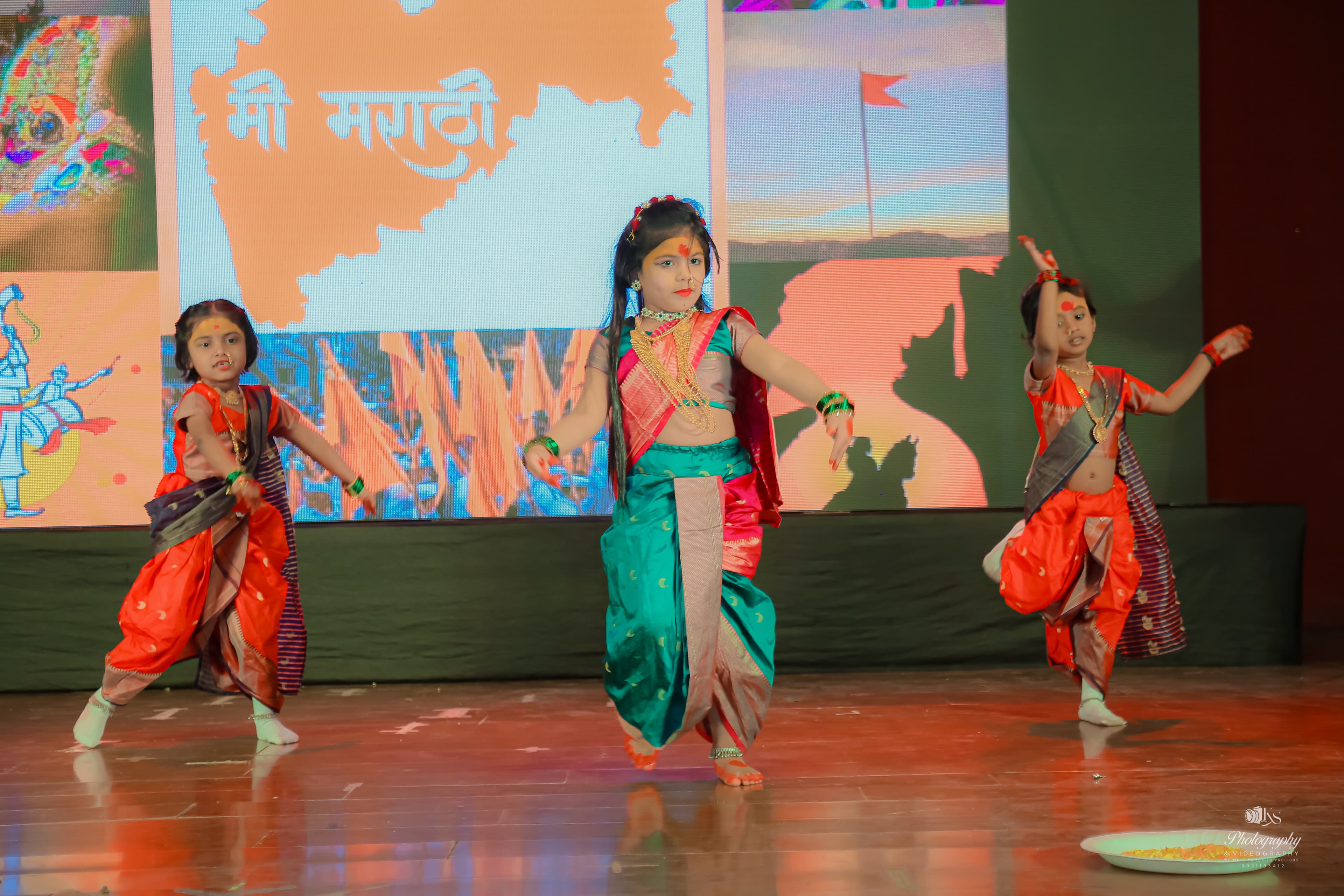 Children performing Maharashtra dance on stage
