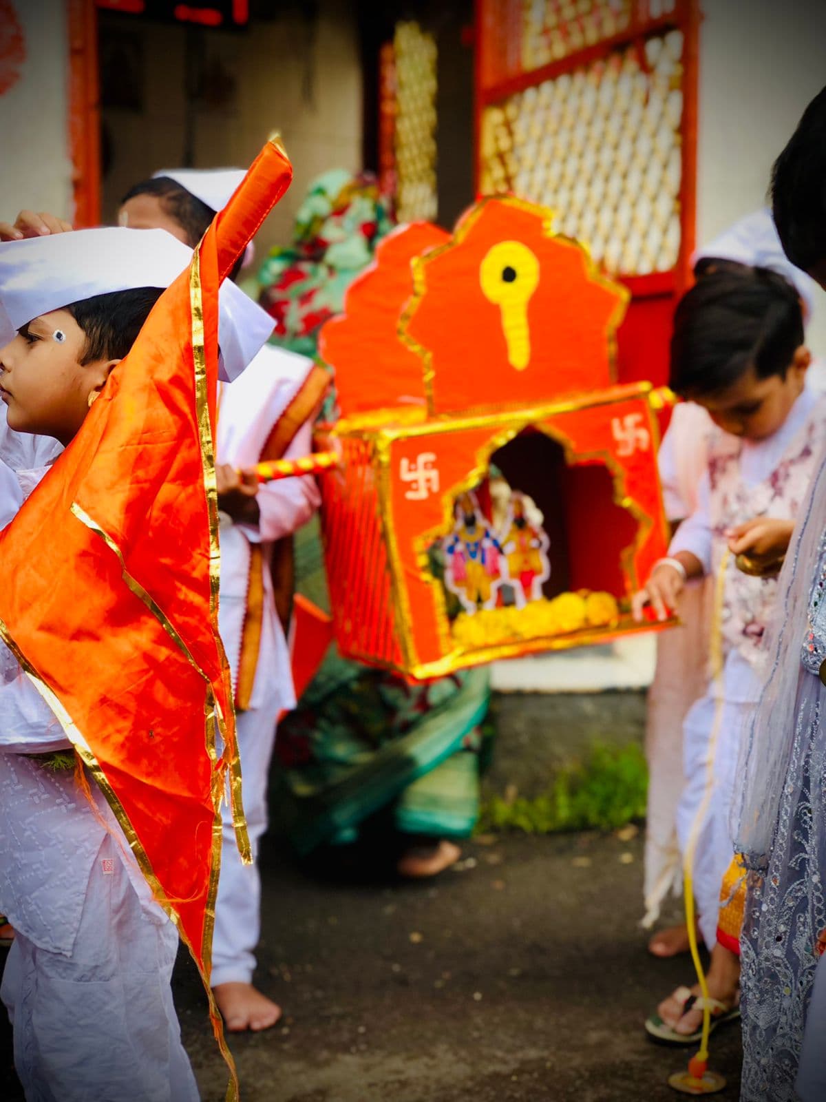 Children celebrating Shree Chhatrapati Shivaji Maharaj Jayanti with a decorated palkhi
